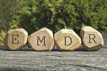 EMDR letters carved on wood