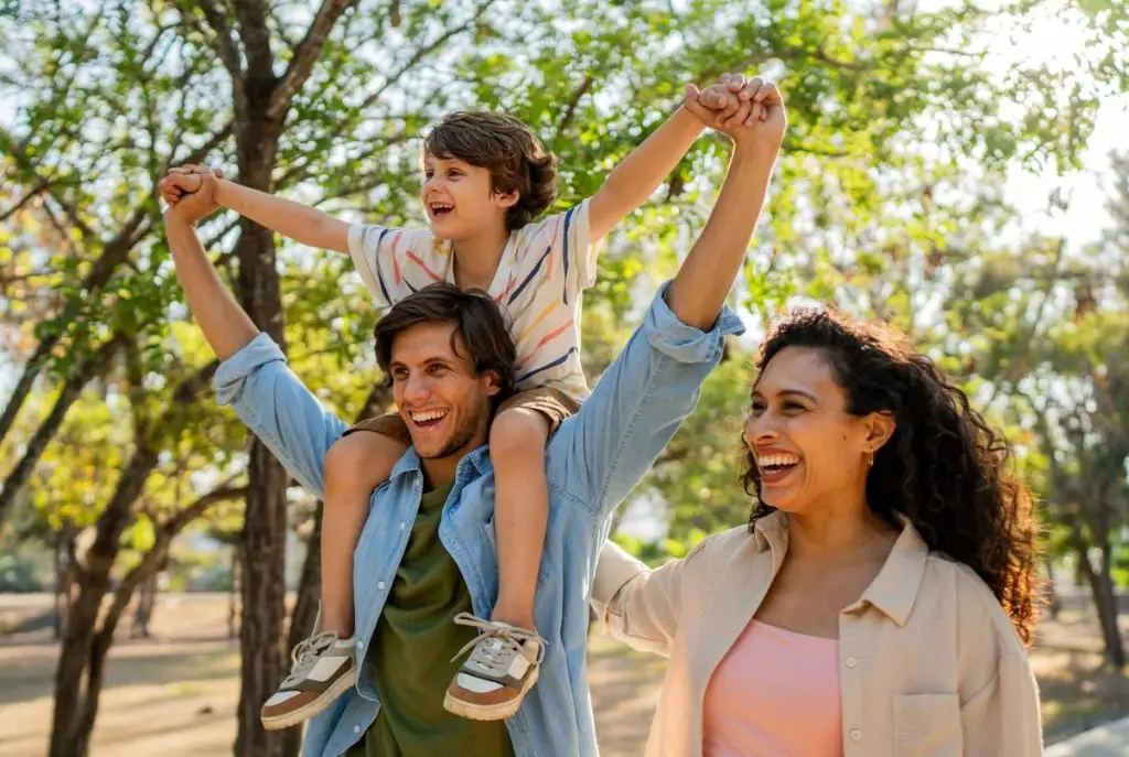 Family walking and playing on public park